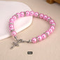 Faux Pearl Charm Bracelet with Rhinestone Spacers & Silver Plated Cross Pendant – Elastic, Available in White, Pink & Black