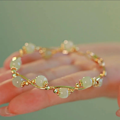 Wire Wrapped Gold Tone Bangle Bracelet with Pale Green Jade-Style Beads – Sculptural Open Design